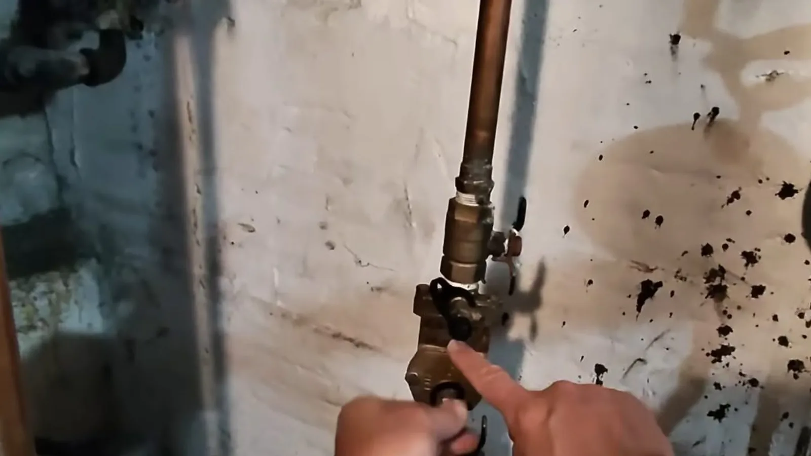 A technician adjusting a backflow device relief valve, related to Fulton County Backflow Testing: What Alpharetta Homeowners Must Do Each Year