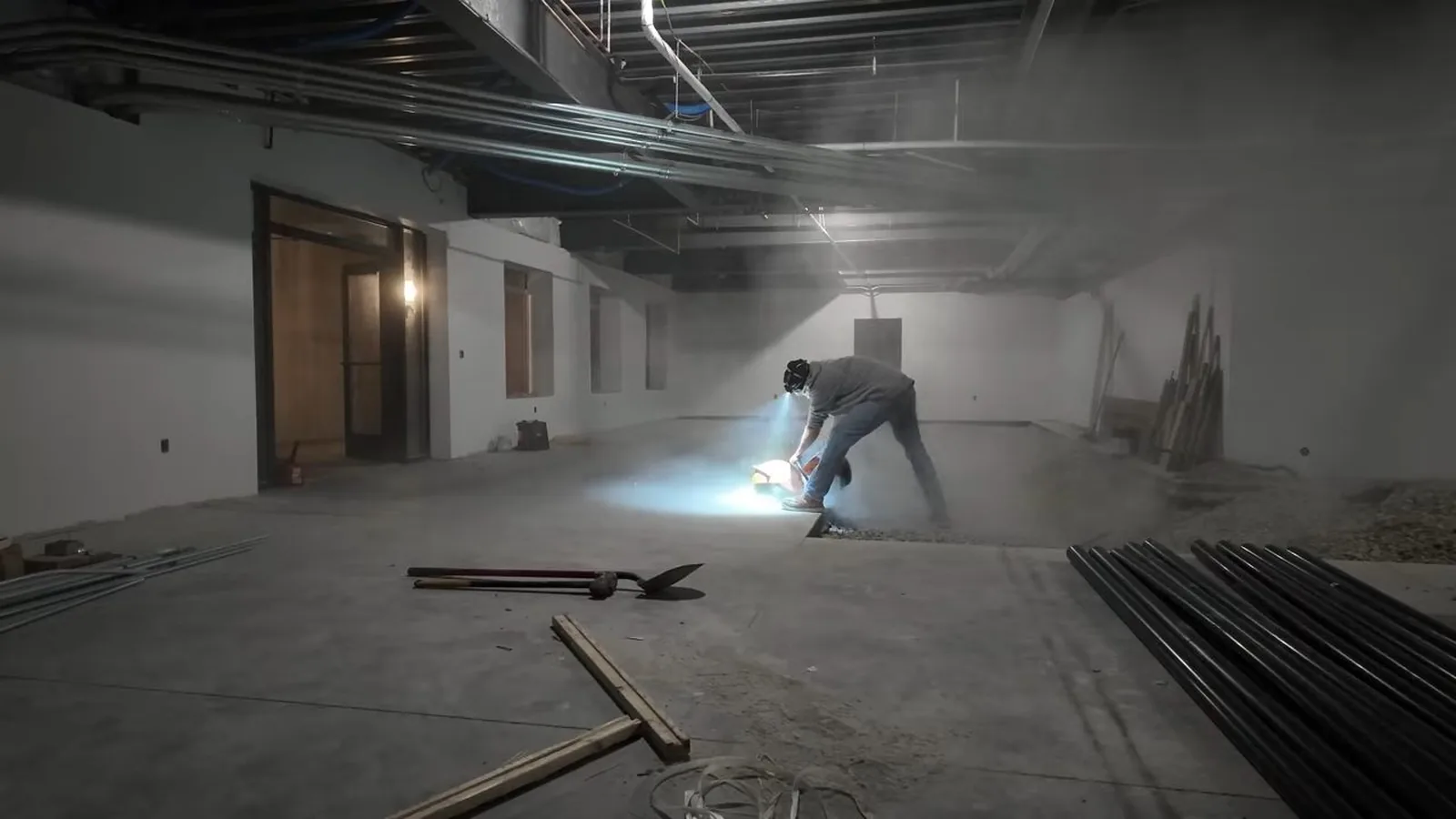Commercial-grade pipe runs overhead in an unfinished space during Commercial Plumbing service in Alpharetta