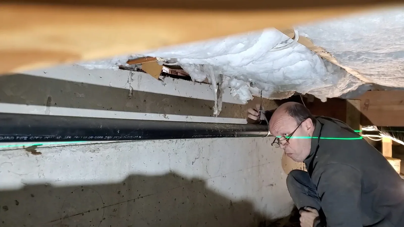 A cleanout added to a crawl space drain run, illustrating Crawl Space Flooding After Summer Storms in Alpharetta: What's Really Happening