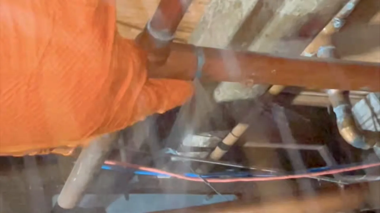 A plumbing line inspected inside a crawl space, related to Crawl Space Flooding After Summer Storms in Alpharetta: What's Really Happening