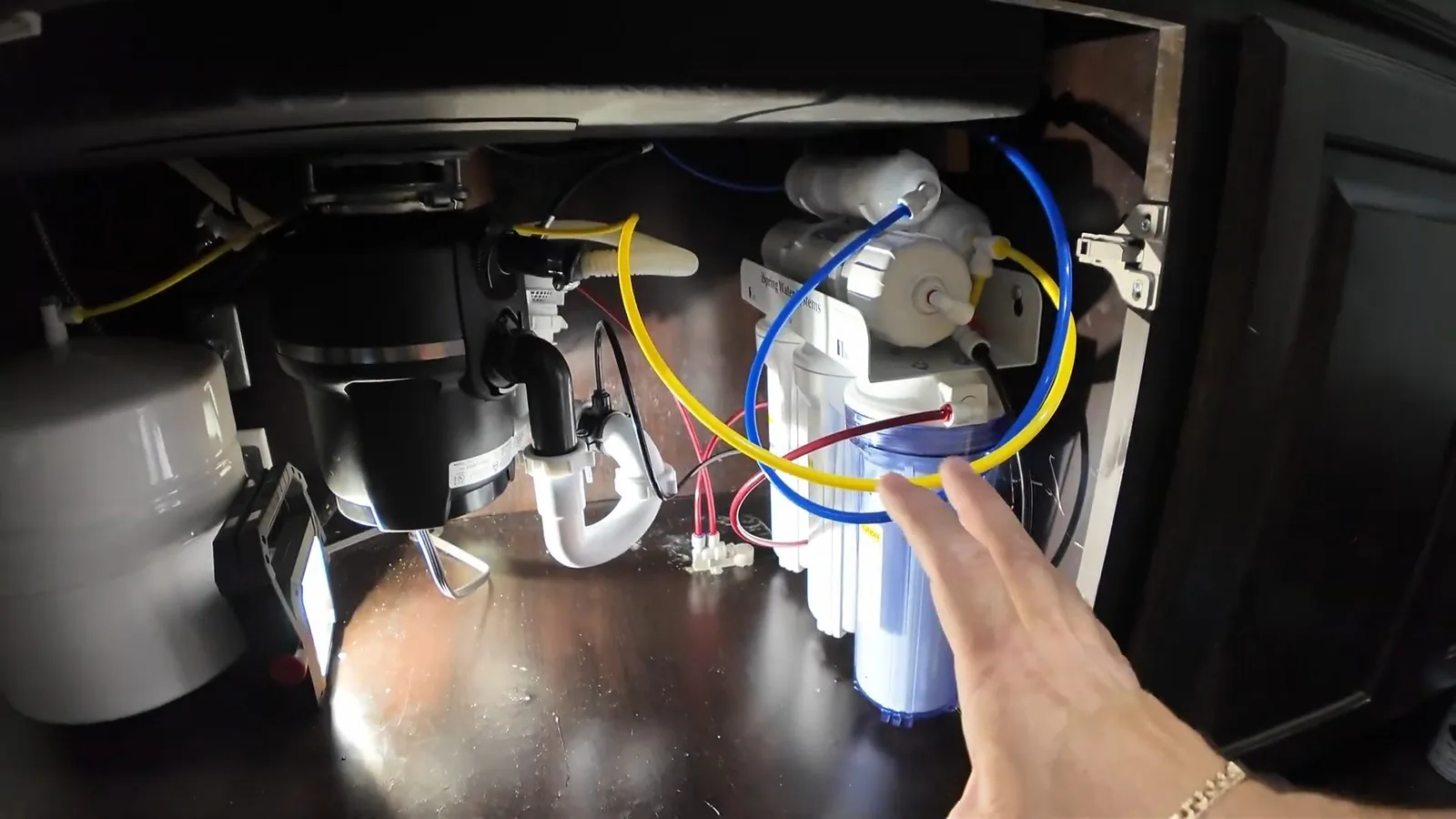 A new disposal unit connected to the sink drain and dishwasher line, related to Garbage Disposal Repair & Installation questions homeowners ask