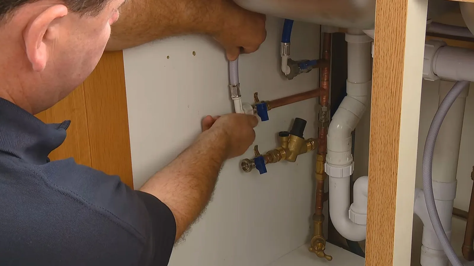 A leaking faucet base being resealed, related to Main Water Shutoff Location in Your Alpharetta Home: Find It Before You Need It