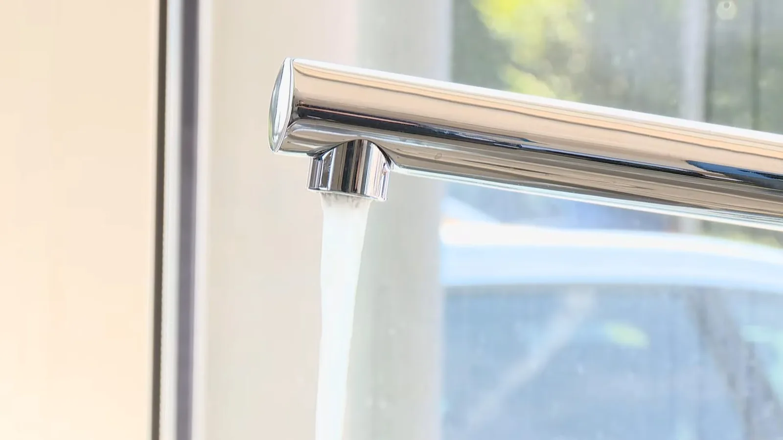 A sink supply line being reconnected under a cabinet, related to Main Water Shutoff Location in Your Alpharetta Home: Find It Before You Need It