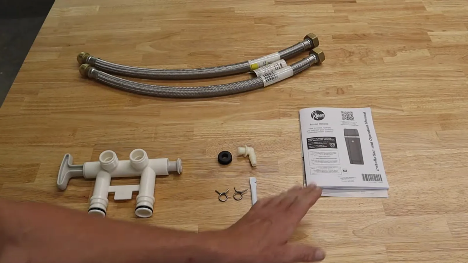 A reverse osmosis membrane housing installed under a sink during a service visit in Mansell