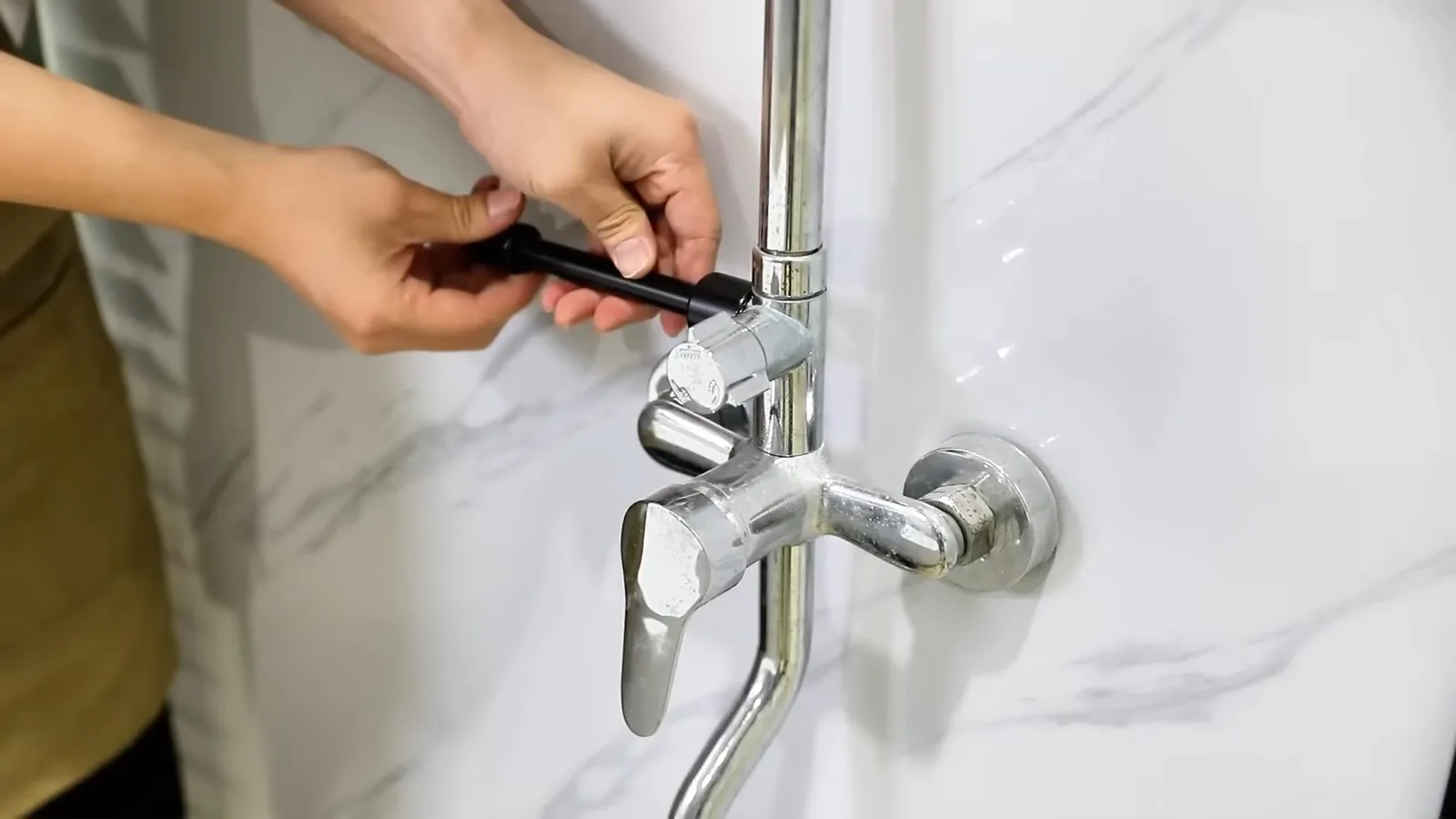 A pipe wrench and fittings staged for a repair, related to When to Stop DIY and Call Your Alpharetta Plumber: A Cost-vs-Risk Guide