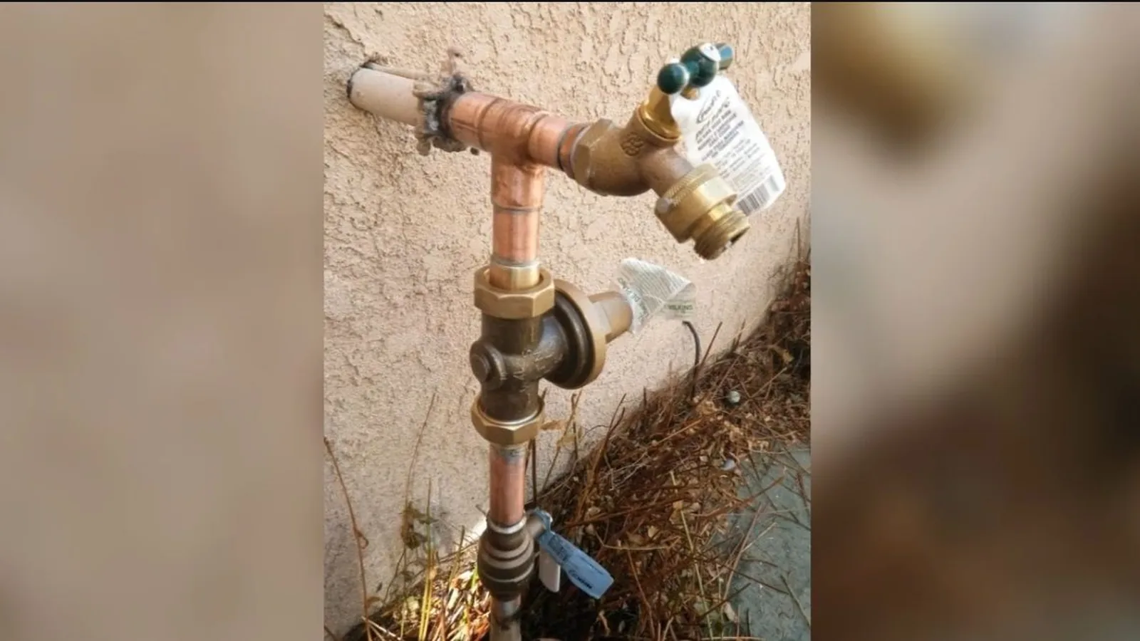 A frost-free hose bib being installed on an exterior wall, related to Irrigation Meter vs Main Meter: How Alpharetta Homeowners Save on Sewer Charges