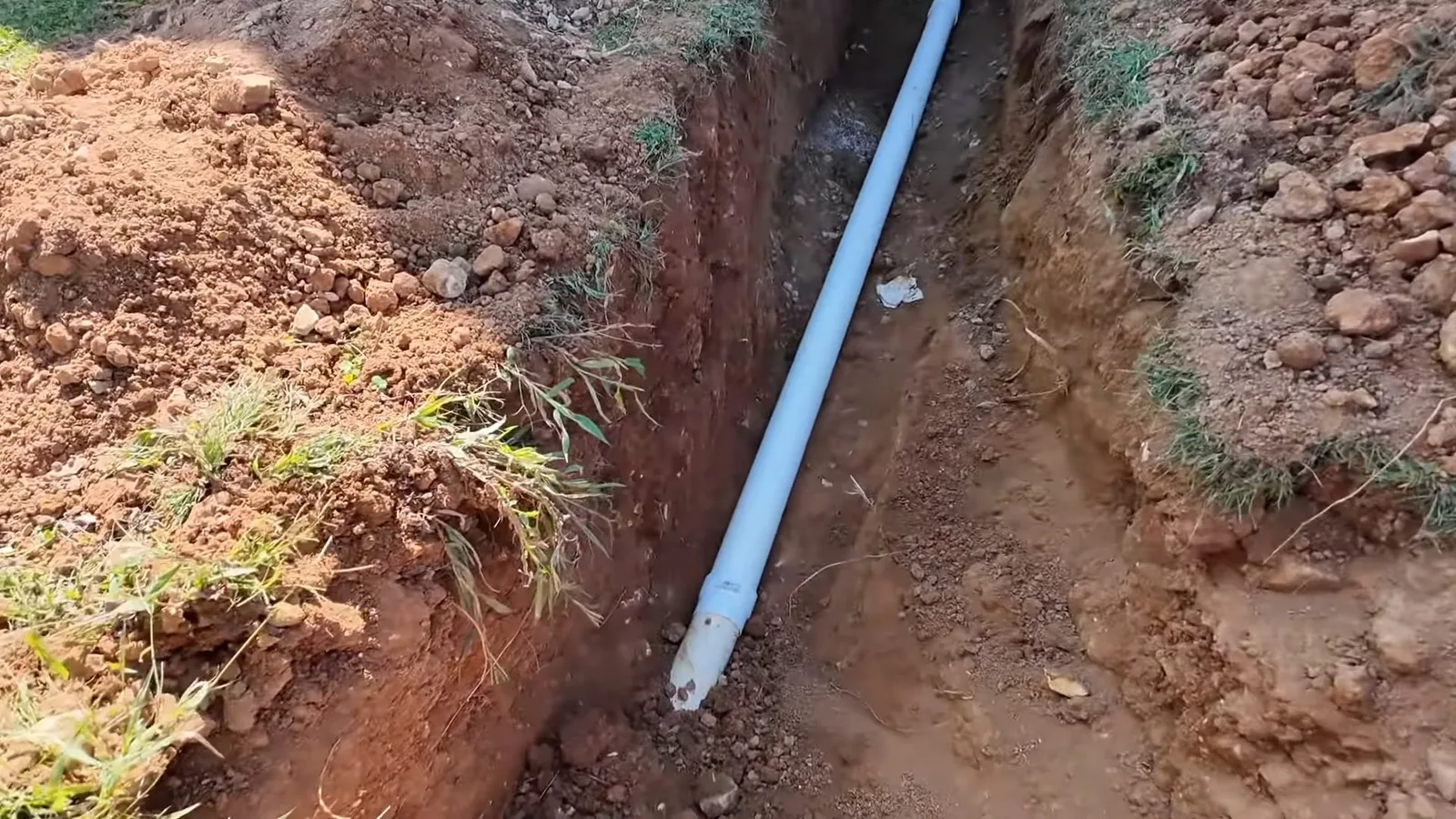 Corrosion inside a cast iron pipe cut open for inspection during Sewer Line Replacement service in Alpharetta