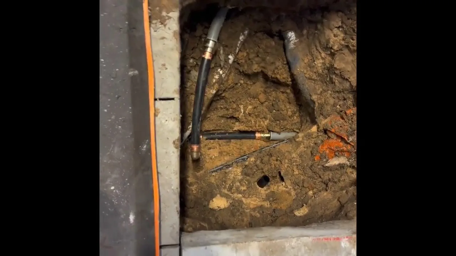 A cracked sewer pipe joint exposed during a dig during Sewer Line Repair service in Alpharetta