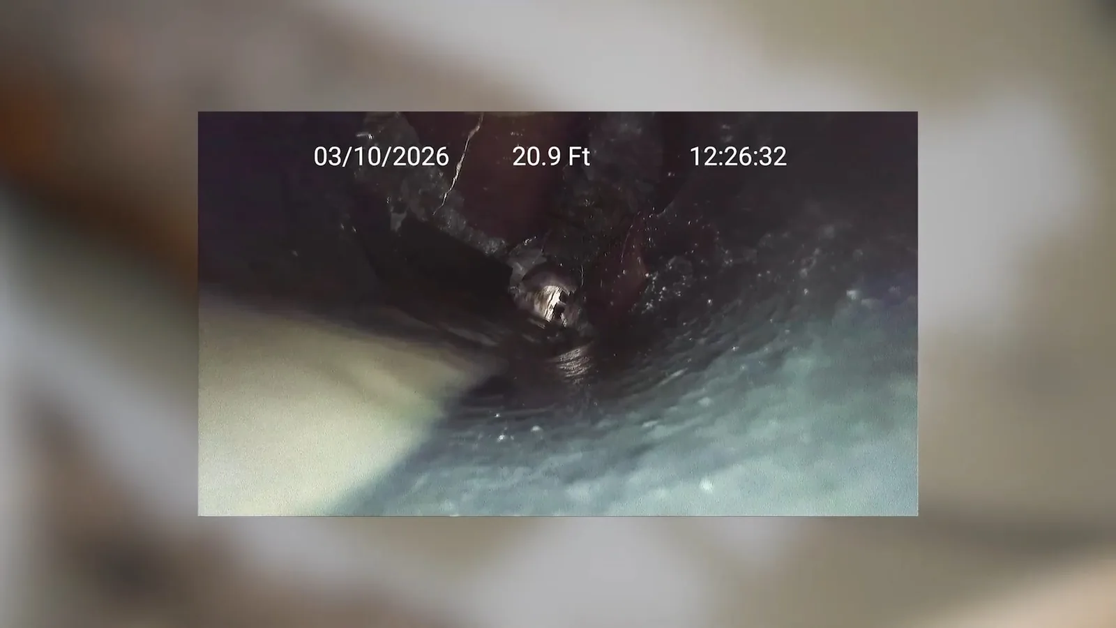 A sewer camera monitor showing the inside of a pipe during a service visit in Marietta, GA