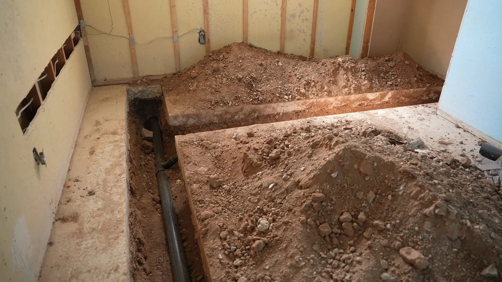 A technician monitoring a trenchless repair from the access point during a service visit in Dunwoody, GA