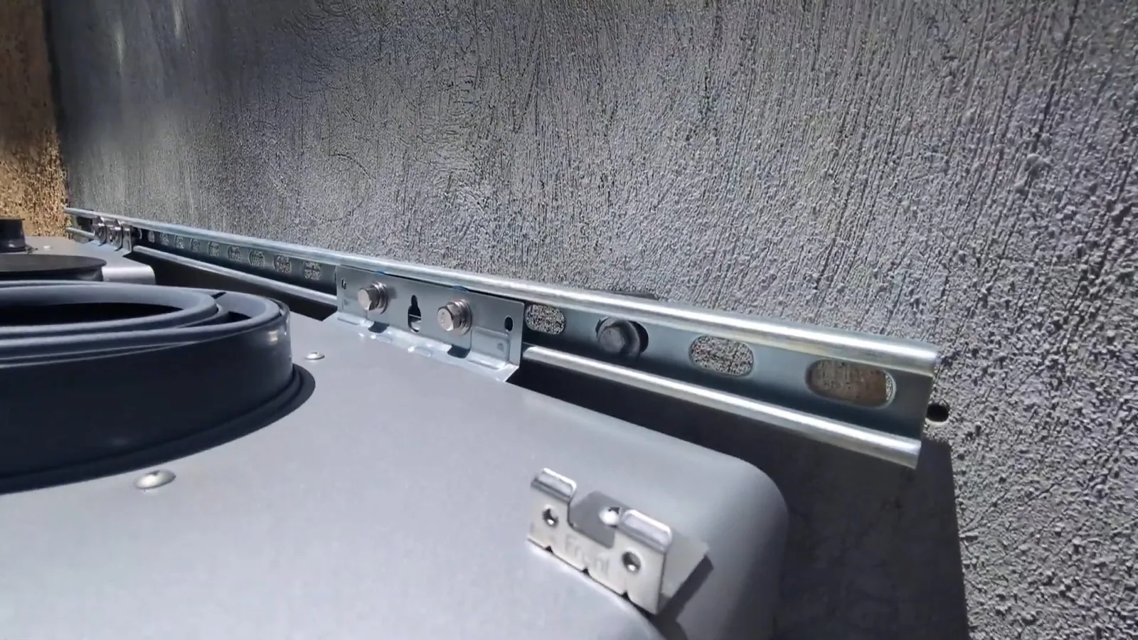 An outdoor tankless water heater mounted on an exterior wall, related to Tankless Water Heater Costs in Alpharetta in 2026: Is It Worth the Upgrade?