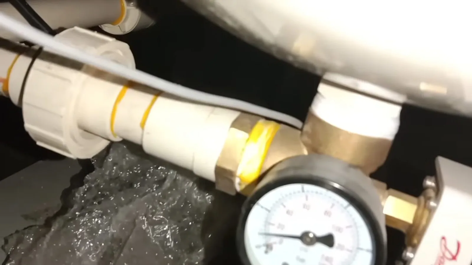 A technician programming a water softener's control head during Water Softener Installation & Repair service in Alpharetta